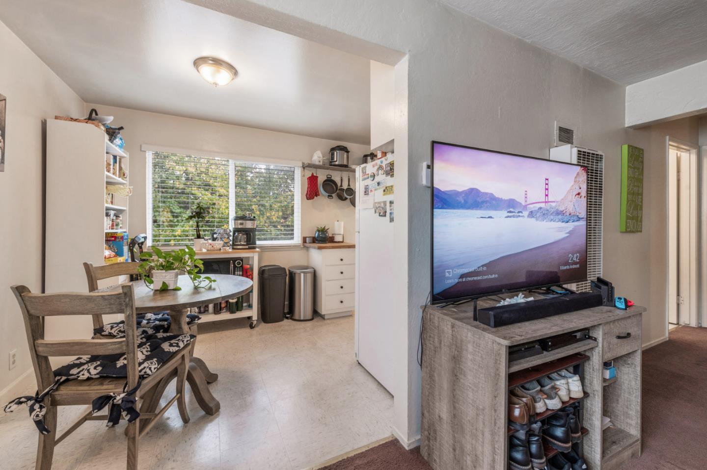 1830 48th Avenue Capitola, CA 95010 - Photo 7 of 32 a kitchen with stainless steel appliances kitchen island granite countertop a refrigerator and a stove top oven