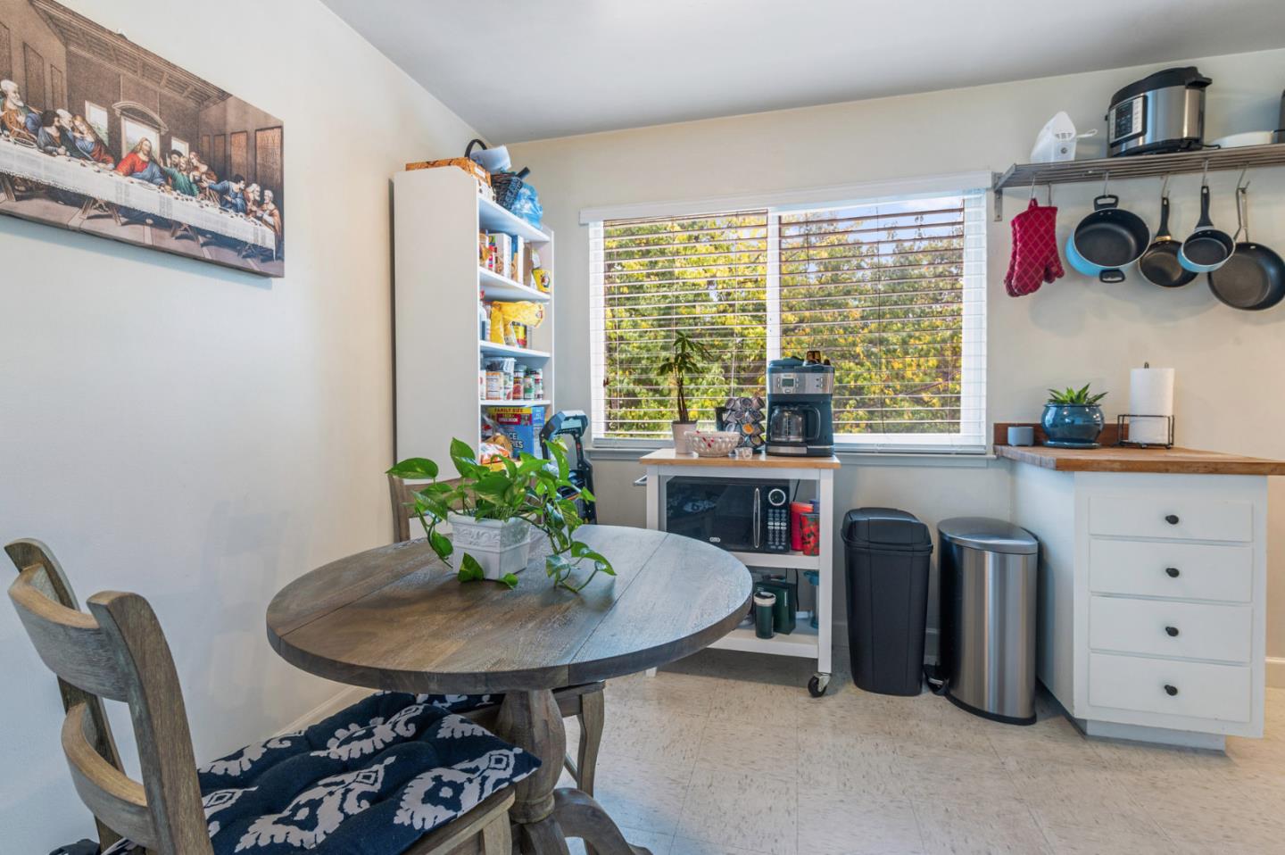1830 48th Avenue Capitola, CA 95010 - Photo 8 of 32 a view of a workspace with furniture and a potted plant