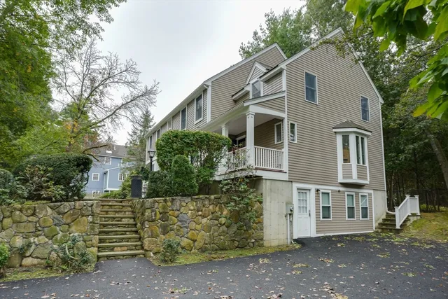 a view of a house with a tree