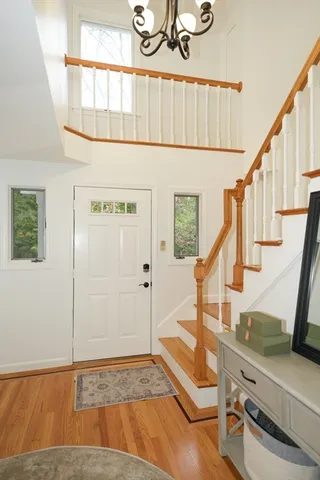 a view of an entryway with wooden floor