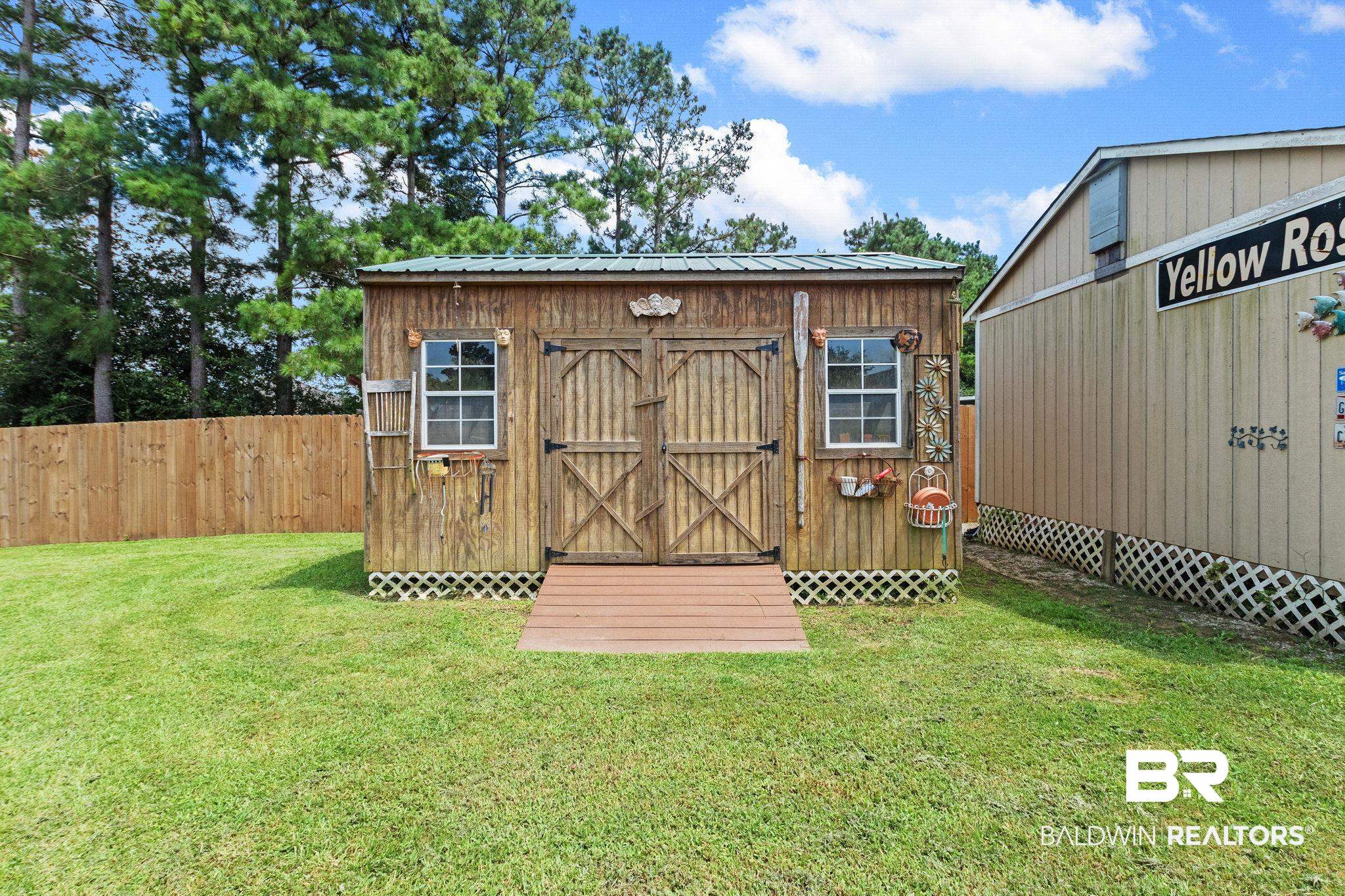 16898 Sugar Loop Foley, AL 36535 - Photo 64 of 67 View of outbuilding with a lawn