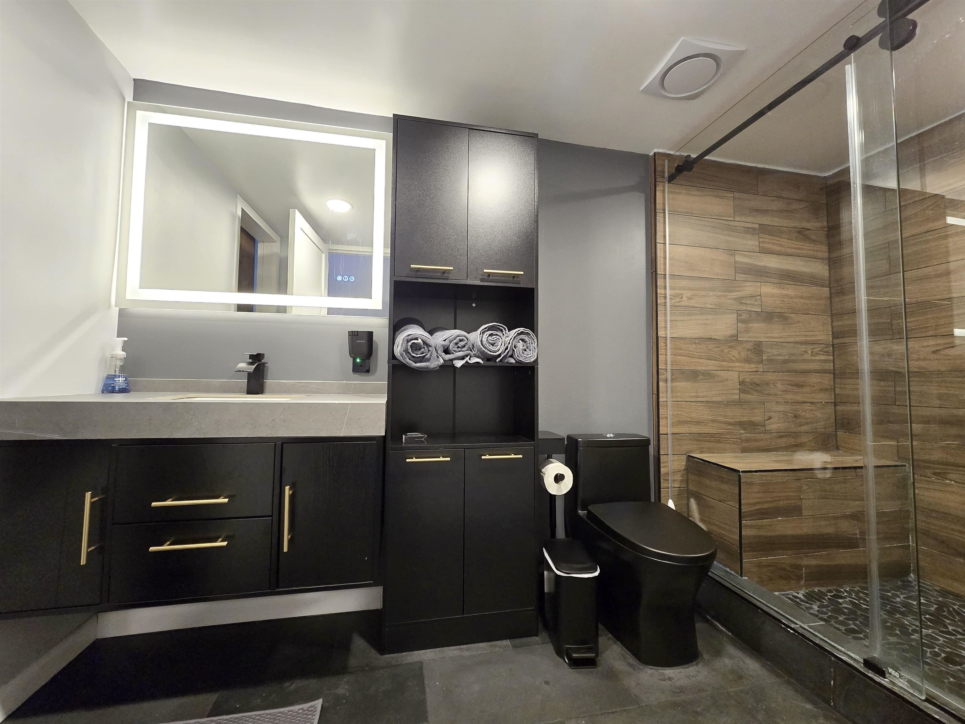 55 Clinton Place, Unit 308 Hackensack, NJ 07601 - Photo 11 of 19 a bathroom with a sink mirror and toilet