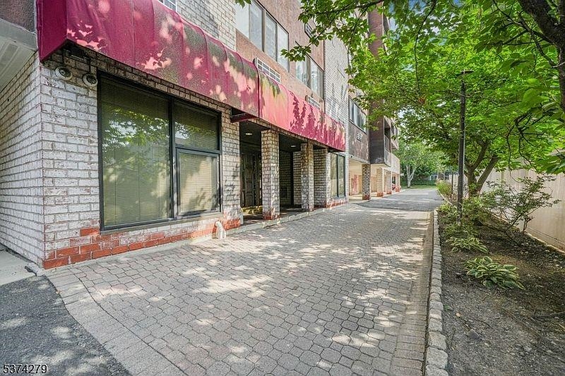 55 Clinton Place, Unit 308 Hackensack, NJ 07601 - Photo 16 of 19 a view of a brick building with a large window