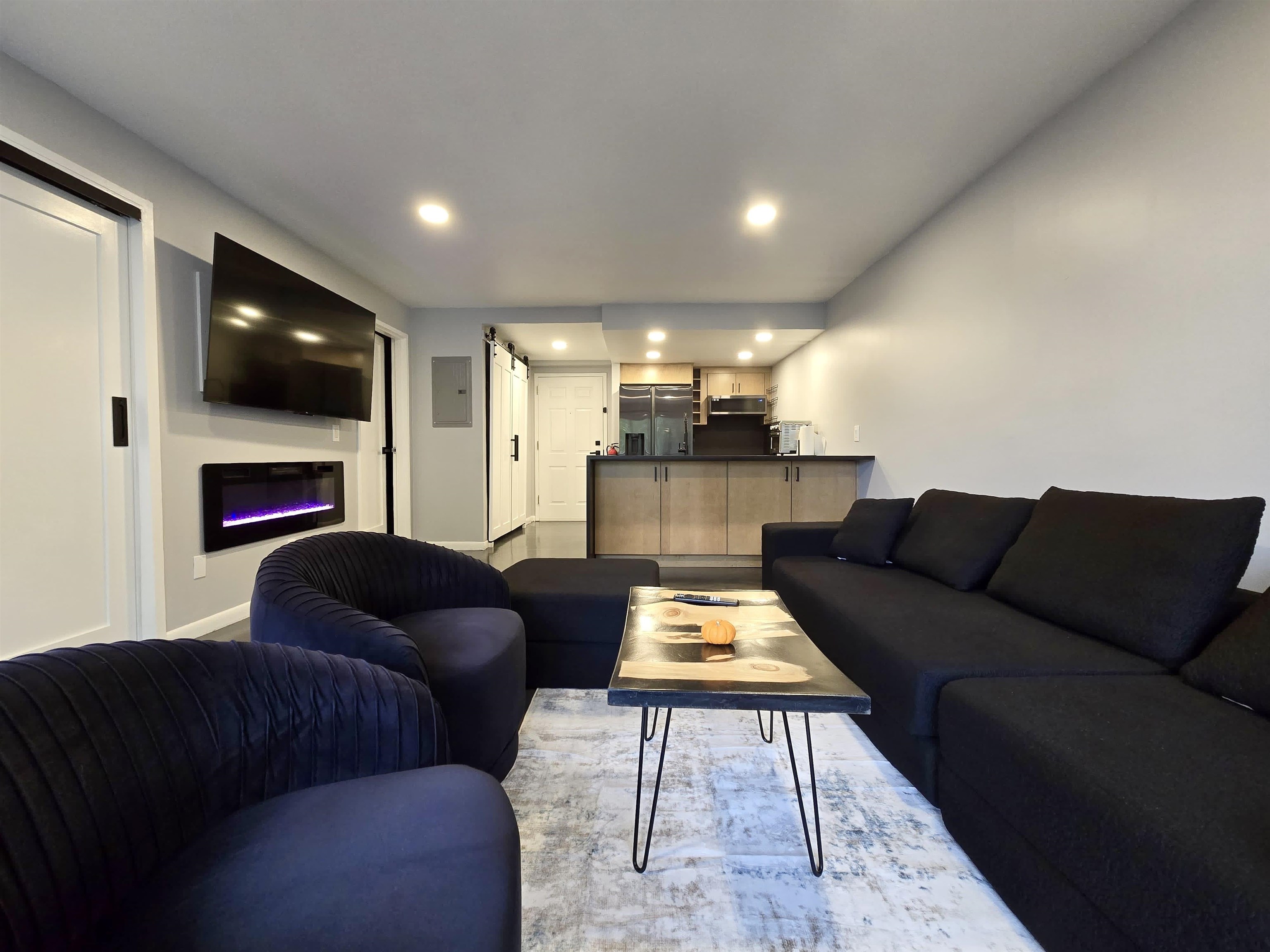 55 Clinton Place, Unit 308 Hackensack, NJ 07601 - Photo 3 of 19 a living room with furniture and a flat screen tv