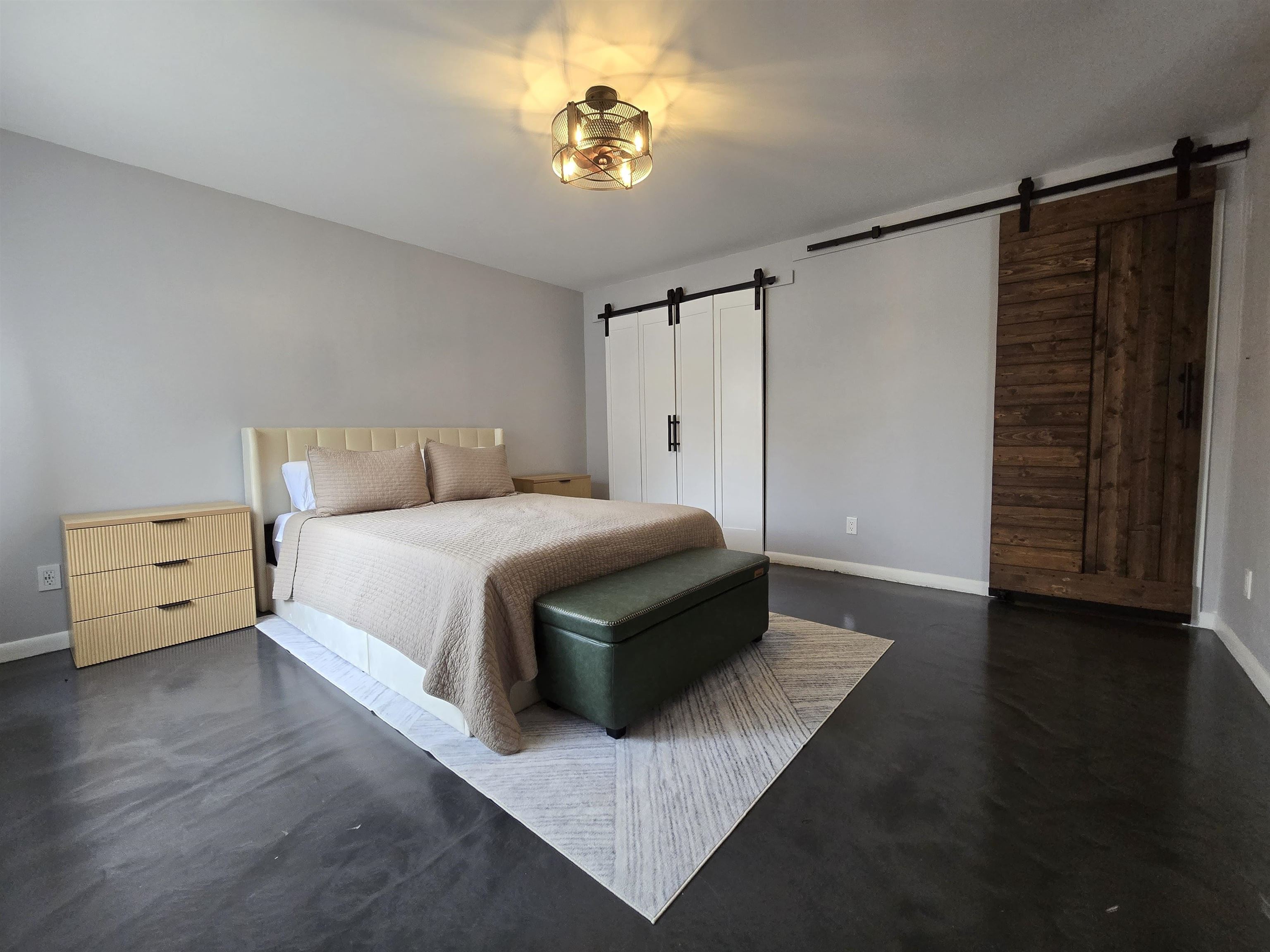 55 Clinton Place, Unit 308 Hackensack, NJ 07601 - Photo 9 of 19 a spacious bedroom with a bed and a chandelier