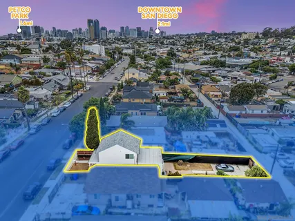 an aerial view of a house with a yard