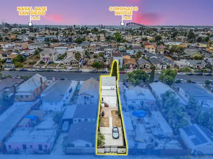 an aerial view of a swimming pool with a yard