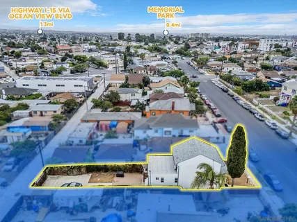 an aerial view of residential houses with outdoor space