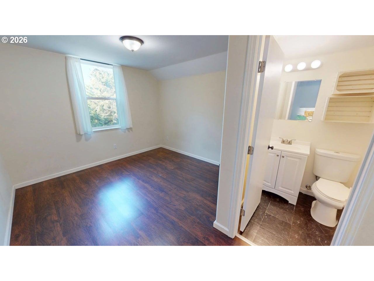 94516 Riley Creek Way Gold Beach, OR 97444 - Photo 20 of 35 a bathroom with a toilet a sink a mirror and a window