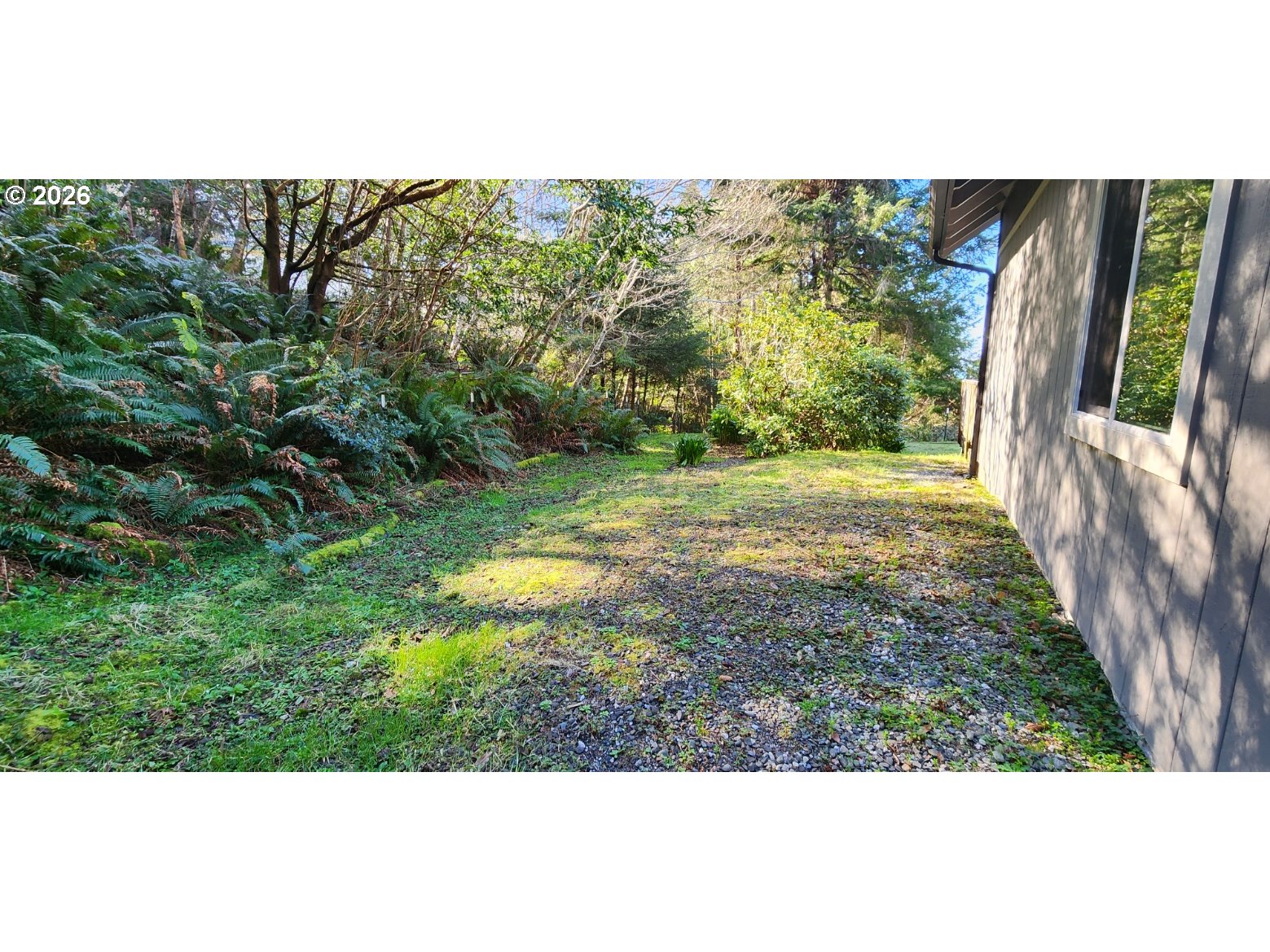 94516 Riley Creek Way Gold Beach, OR 97444 - Photo 27 of 35 a view of a yard with an outdoor space