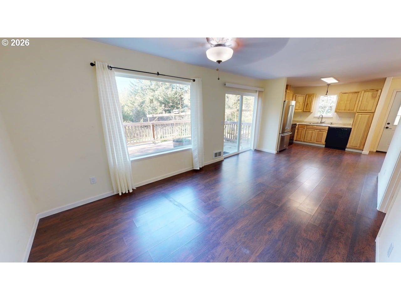 94516 Riley Creek Way Gold Beach, OR 97444 - Photo 4 of 35 a room with wooden floors and windows