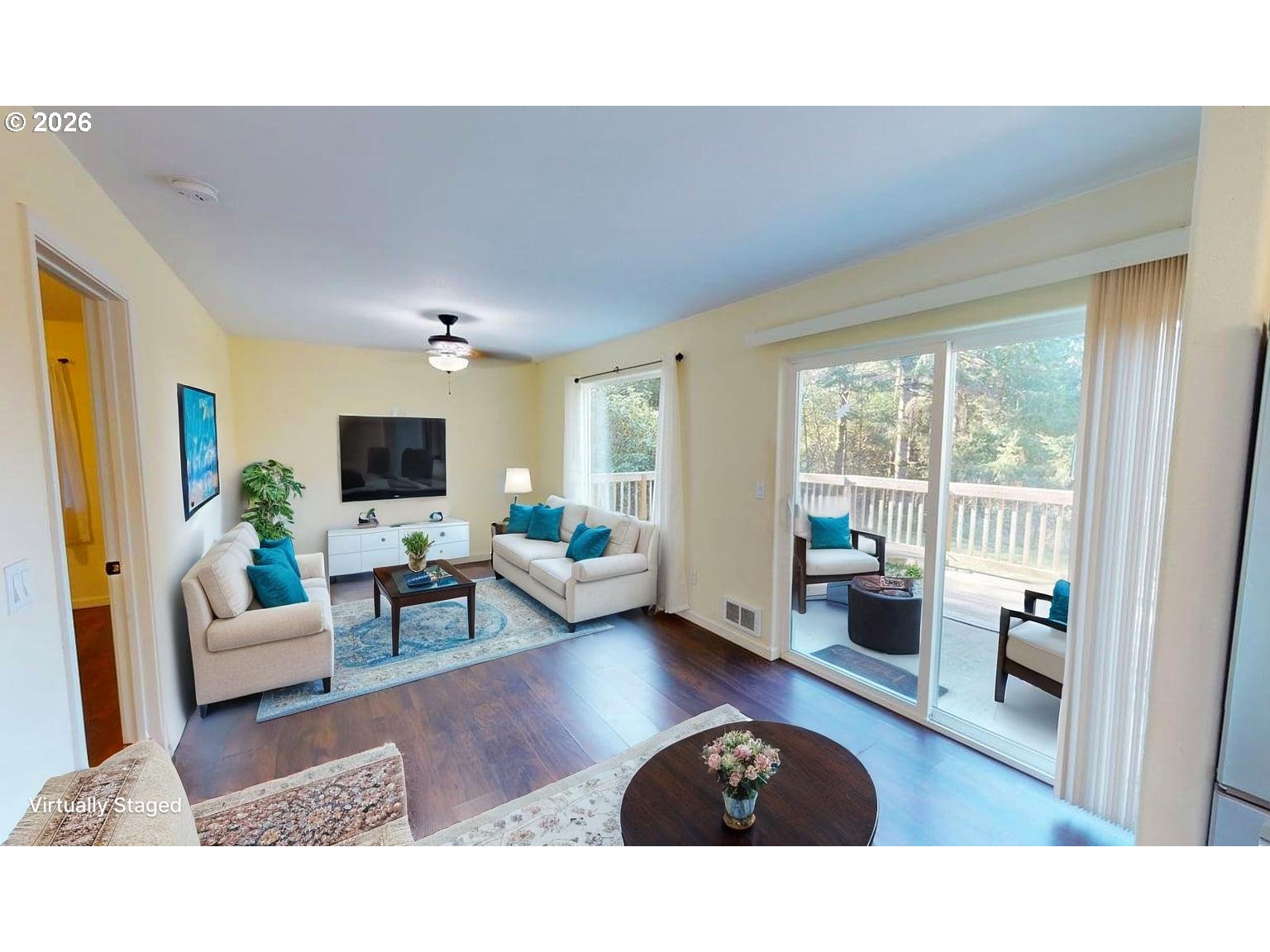 94516 Riley Creek Way Gold Beach, OR 97444 - Photo 5 of 35 a living room with furniture a flat screen tv and a large window