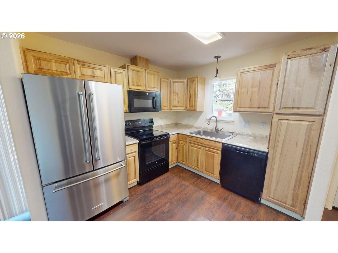 94516 Riley Creek Way Gold Beach, OR 97444 - Photo 7 of 35 a kitchen with stainless steel appliances a refrigerator and a sink