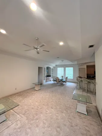 a view of a livingroom with furniture and a flat screen tv