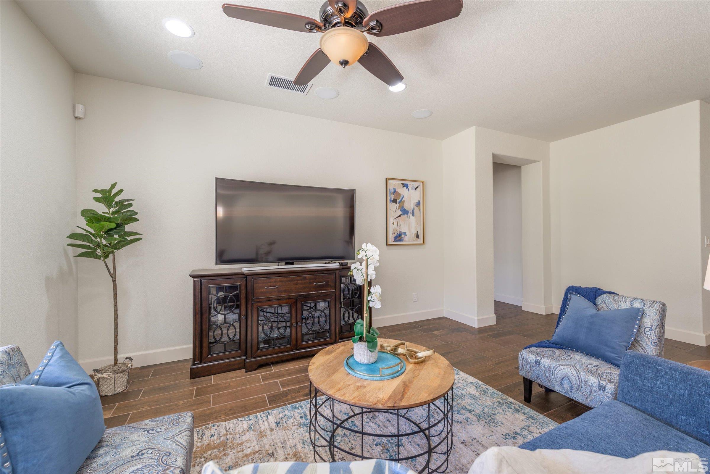 9207 Maplehurst Trail Reno, NV 89523 - Photo 11 of 40 a living room with furniture and a flat screen tv