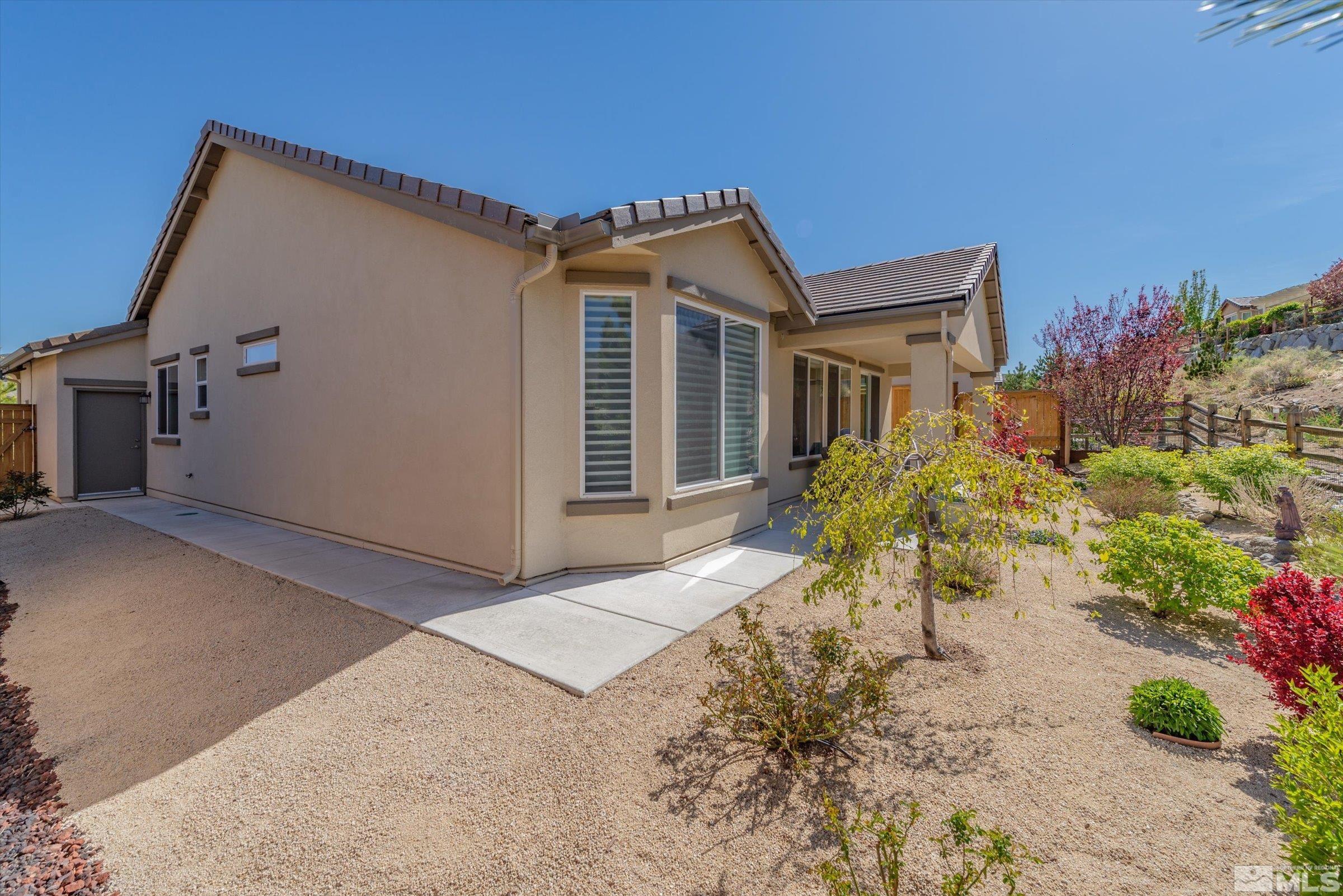 9207 Maplehurst Trail Reno, NV 89523 - Photo 21 of 40 a view of a house with a yard