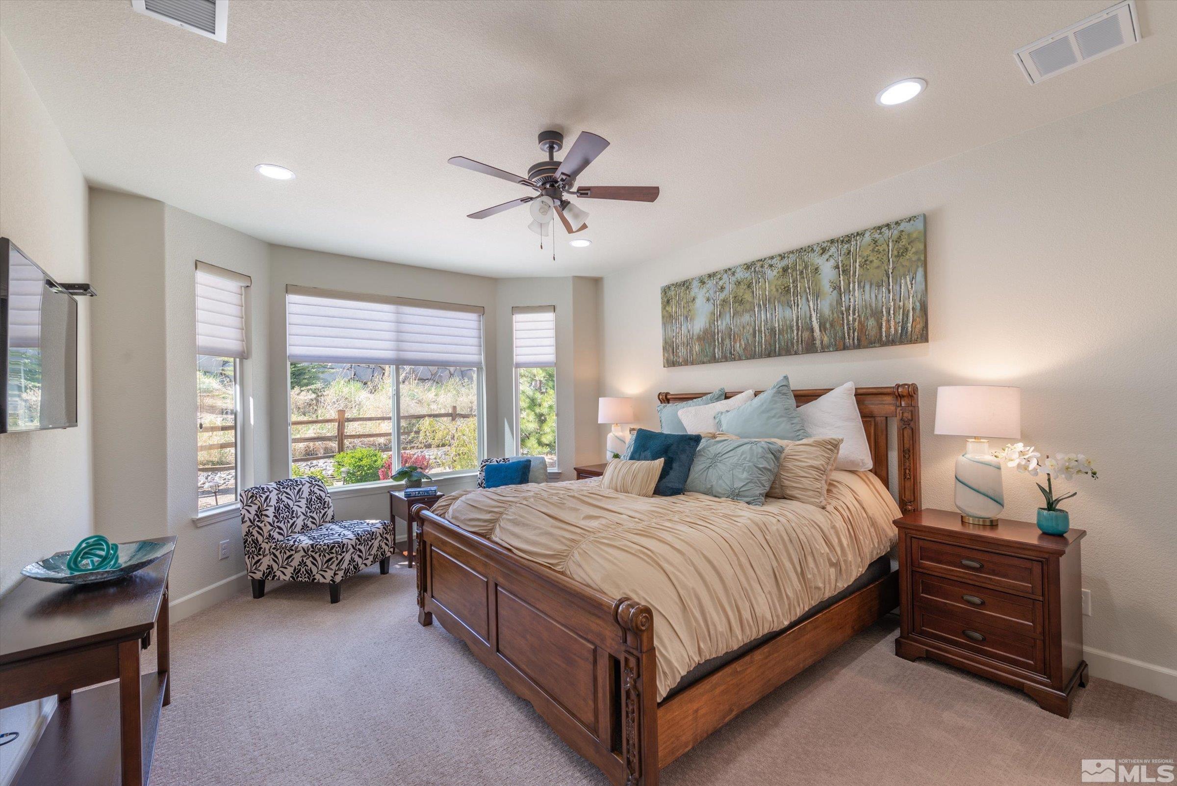 9207 Maplehurst Trail Reno, NV 89523 - Photo 22 of 40 a bedroom with a bed and large windows