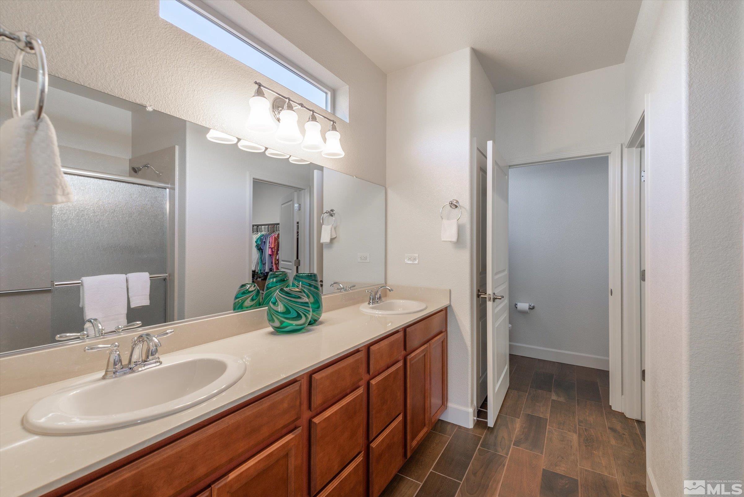 9207 Maplehurst Trail Reno, NV 89523 - Photo 24 of 40 a bathroom with a sink and a mirror