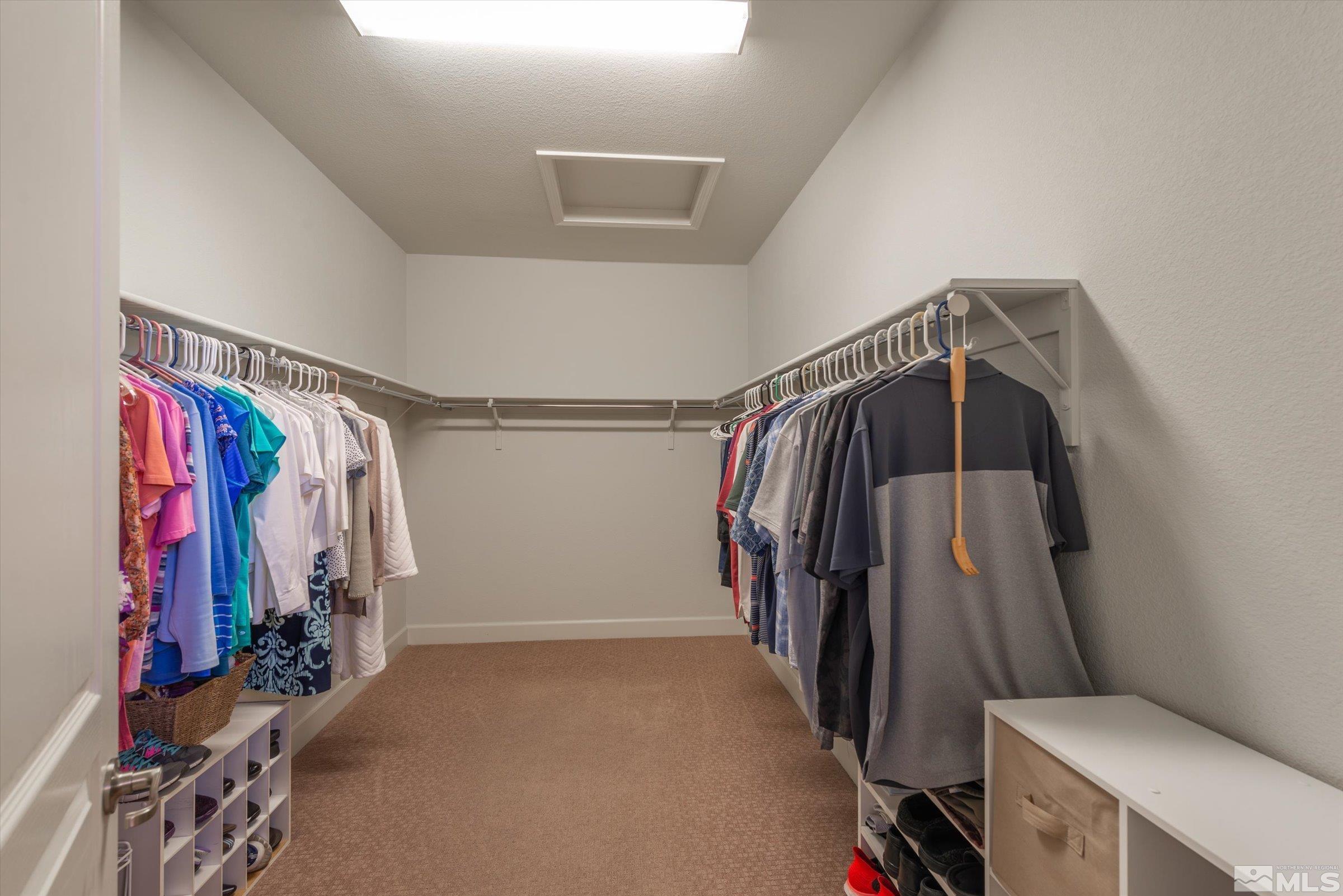 9207 Maplehurst Trail Reno, NV 89523 - Photo 26 of 40 a view of walk in closet with clothes and shoes