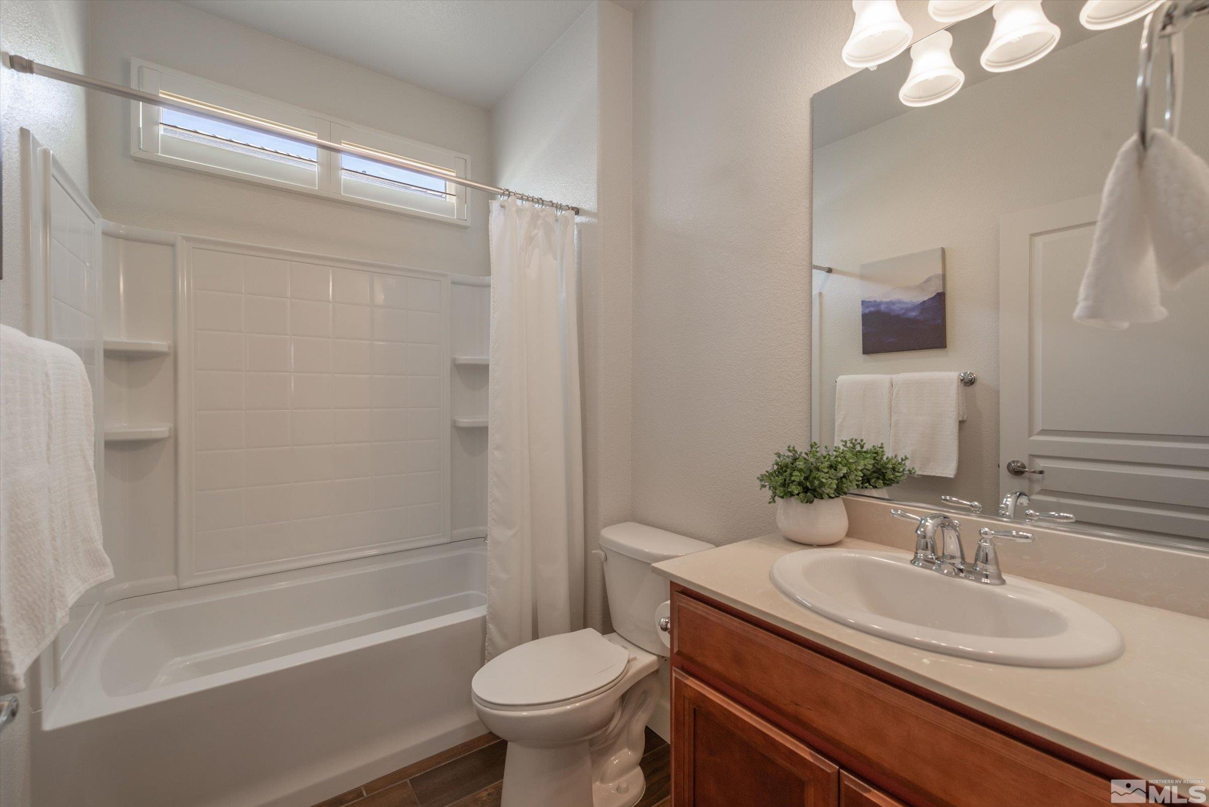 9207 Maplehurst Trail Reno, NV 89523 - Photo 28 of 40 a bathroom with a granite countertop sink toilet and shower
