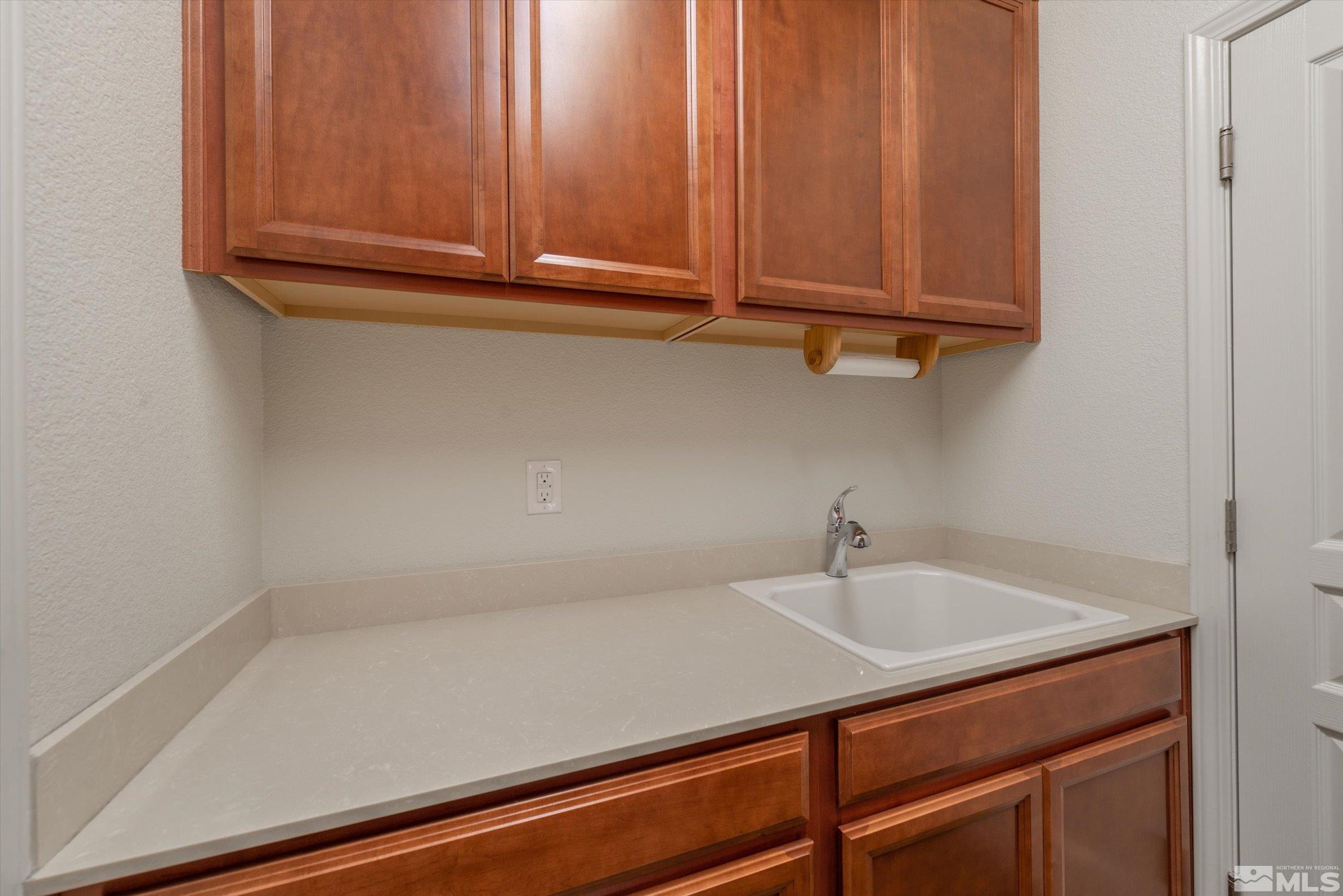 9207 Maplehurst Trail Reno, NV 89523 - Photo 31 of 40 a bathroom with a sink and cabinets