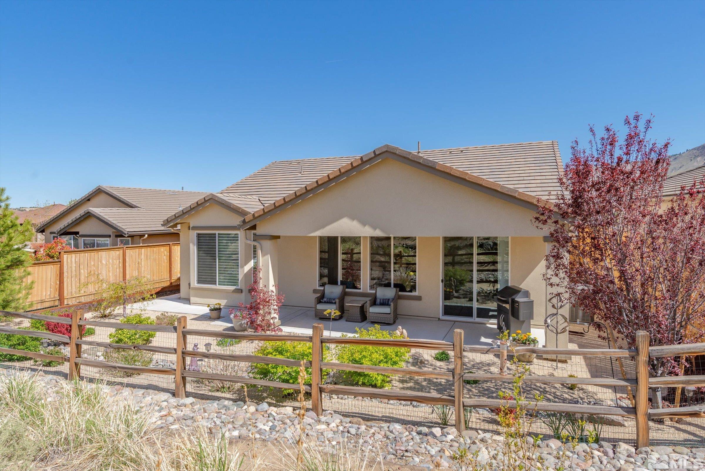 9207 Maplehurst Trail Reno, NV 89523 - Photo 6 of 40 a front view of a house with garden