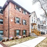 a front view of a building with brick walls