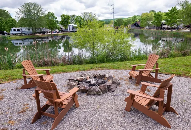an outdoor sitting area with lake view