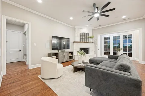 a living room with furniture fireplace and a flat screen tv