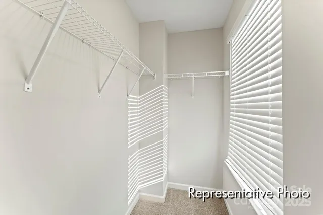 a view of a bedroom with stairs
