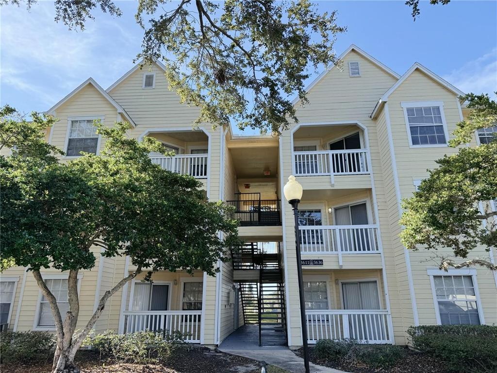 1013 South Hiawassee Road, Unit 3635 Orlando, FL 32835 - Photo 1 of 18 a front view of a house with balcony