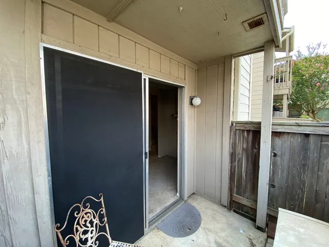 a white toilet sitting next to a sink