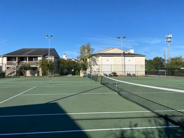 a view of a swimming pool with outdoor seating