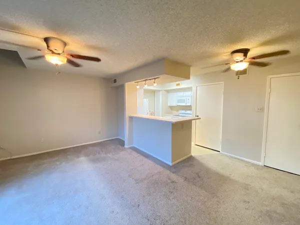 a view of a kitchen with a sink and cabinet