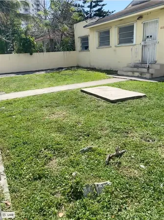 a view of a backyard with a house