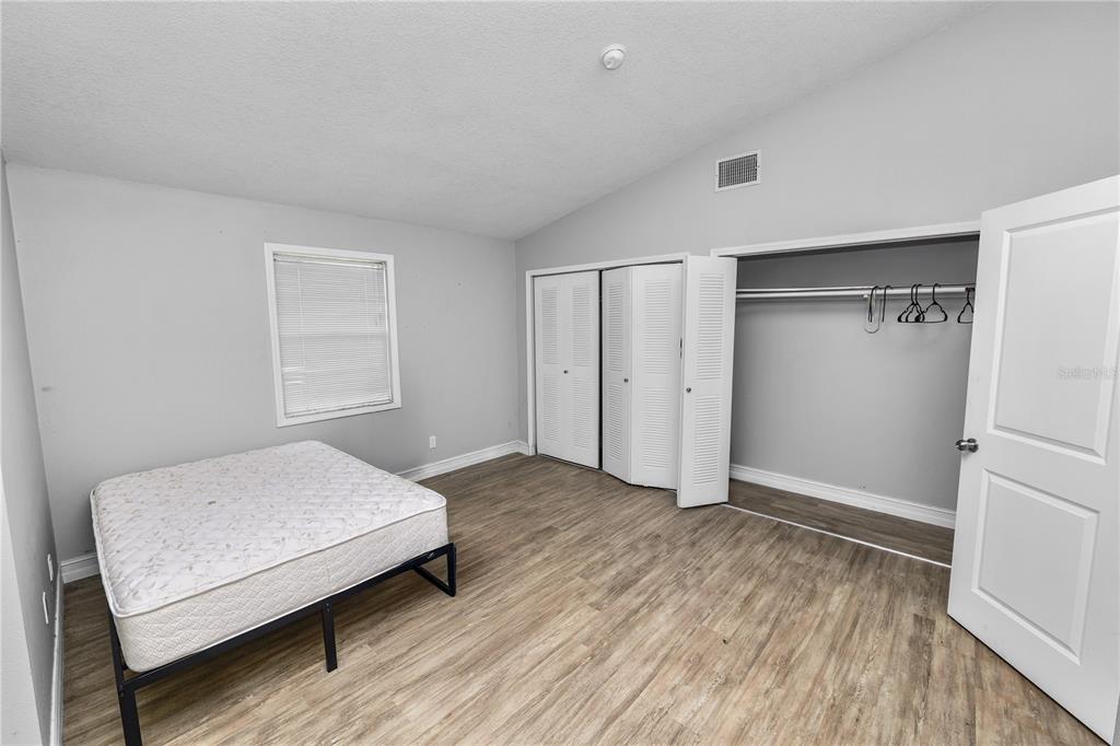 3307 Fox Ridge Drive Winter Haven, FL 33884 - Photo 11 of 27 a bedroom with a bed and a window