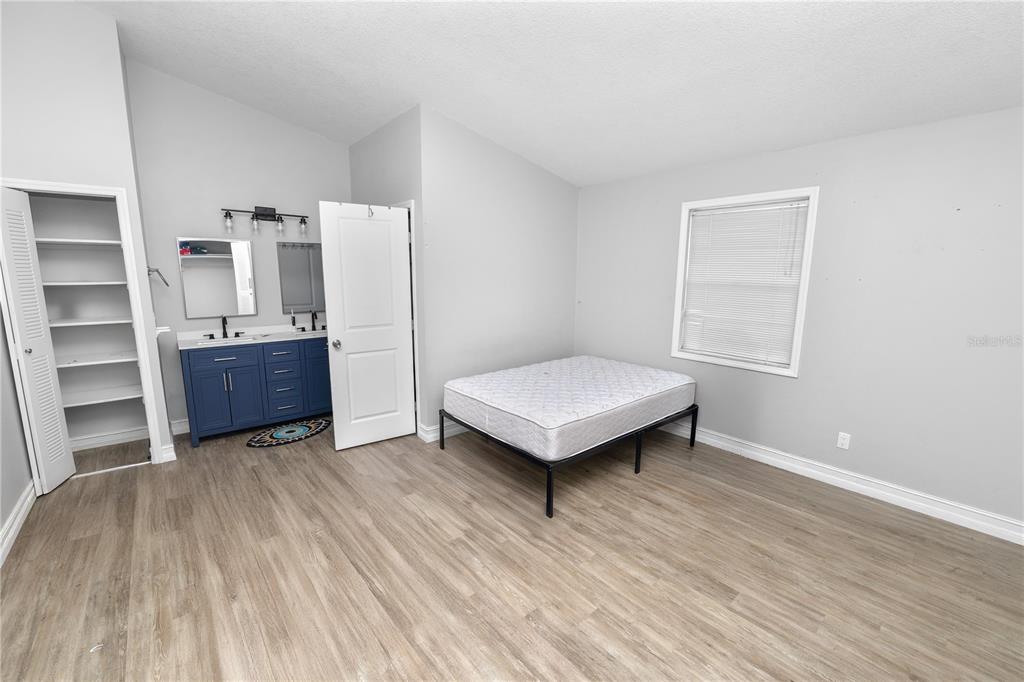 3307 Fox Ridge Drive Winter Haven, FL 33884 - Photo 12 of 27 a view of a room with wooden floor and cabinet