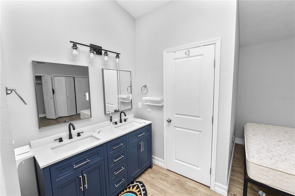 3307 Fox Ridge Drive Winter Haven, FL 33884 - Photo 14 of 27 a bathroom with a double vanity sink mirror and