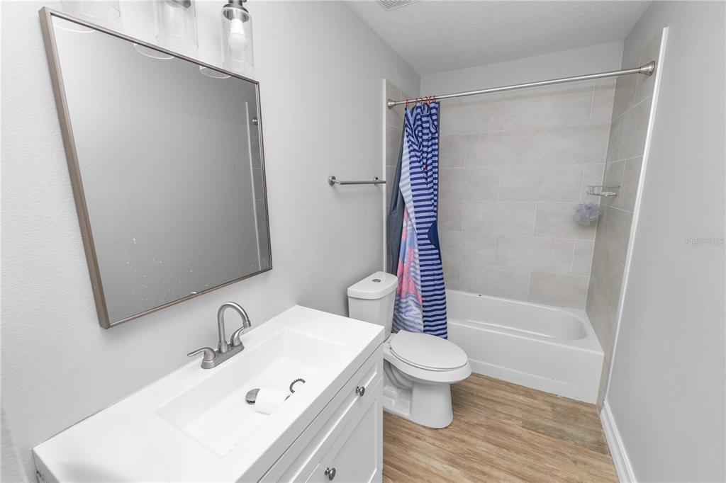 3307 Fox Ridge Drive Winter Haven, FL 33884 - Photo 18 of 27 a bathroom with a sink toilet and shower