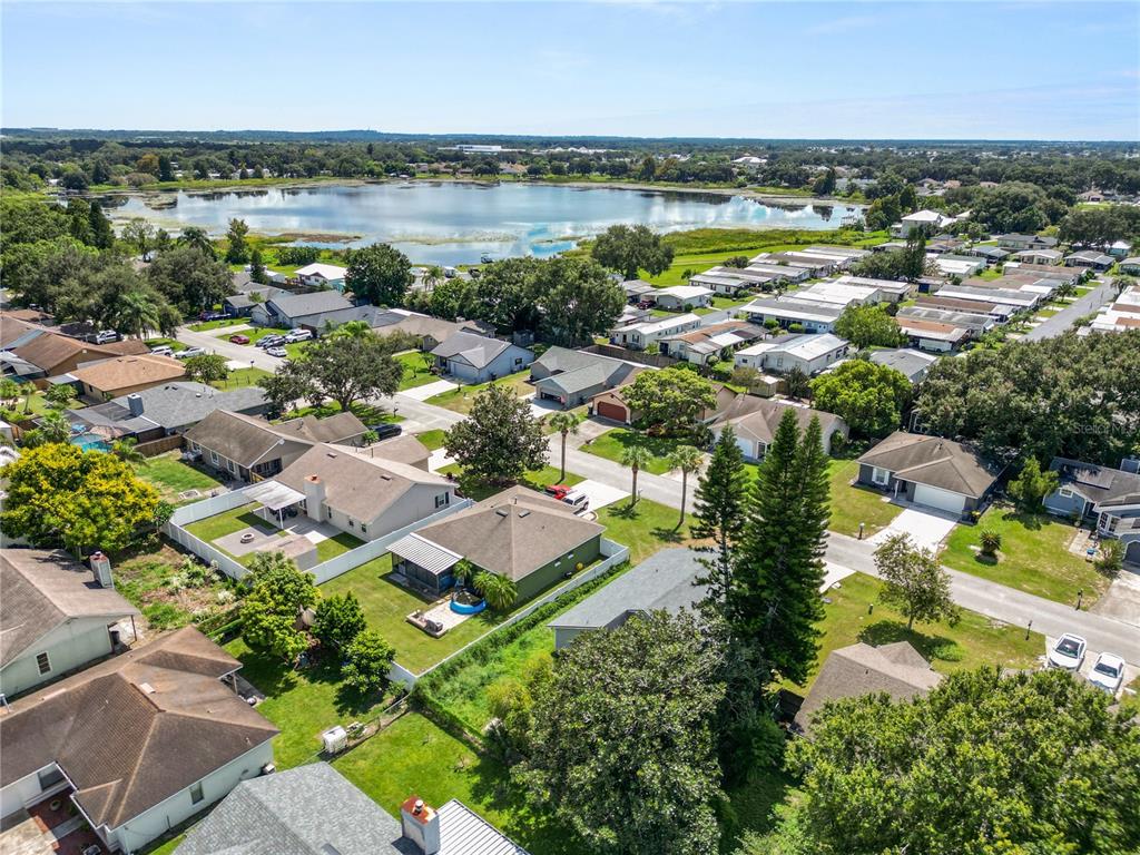 3307 Fox Ridge Drive Winter Haven, FL 33884 - Photo 21 of 27 an aerial view of residential building with outdoor space and lake view