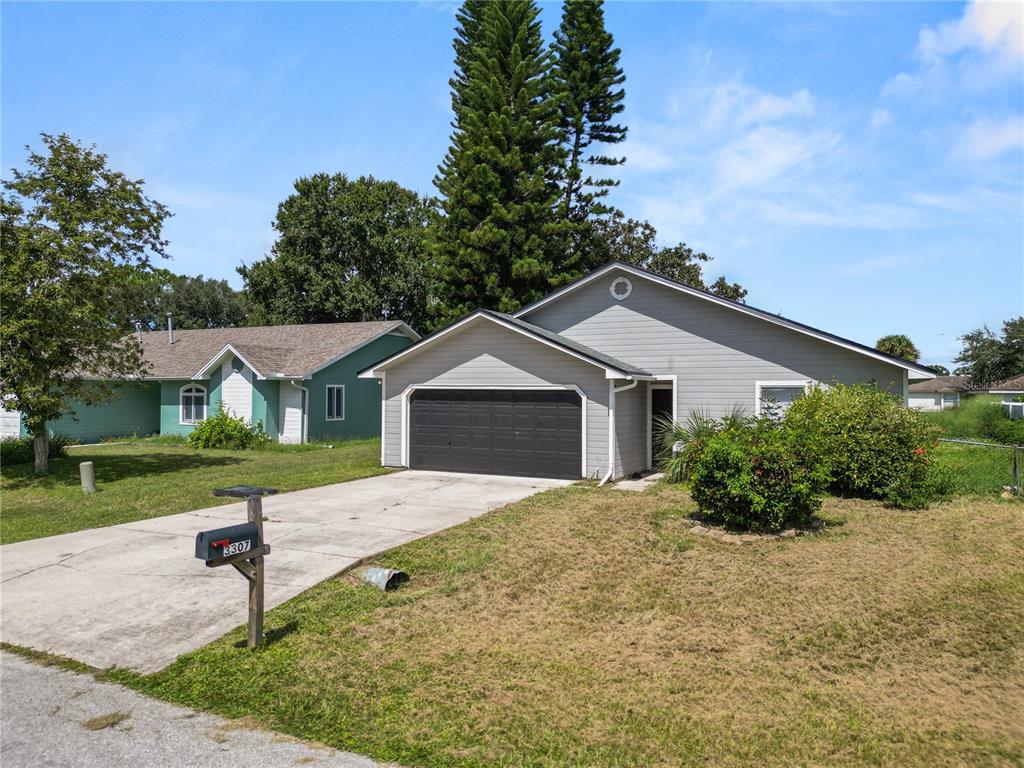 3307 Fox Ridge Drive Winter Haven, FL 33884 - Photo 25 of 27 a white house that has tree in front of it