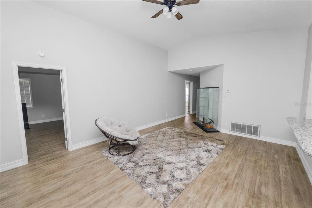 3307 Fox Ridge Drive Winter Haven, FL 33884 - Photo 5 of 27 a view of a livingroom with a wooden floor and a sink
