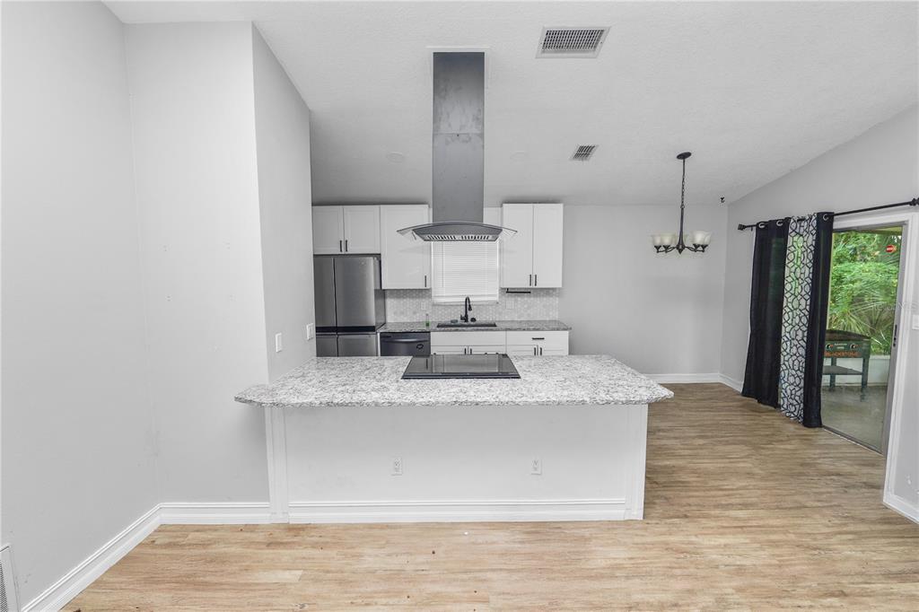 3307 Fox Ridge Drive Winter Haven, FL 33884 - Photo 6 of 27 a close view of kitchen countertops with wooden floor