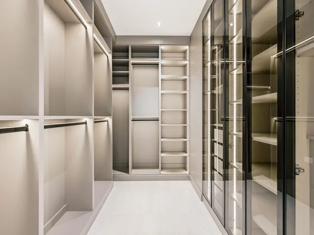 a view of walk in closet with empty racks