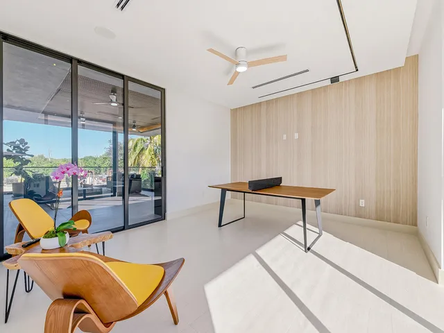 a living room with patio furniture