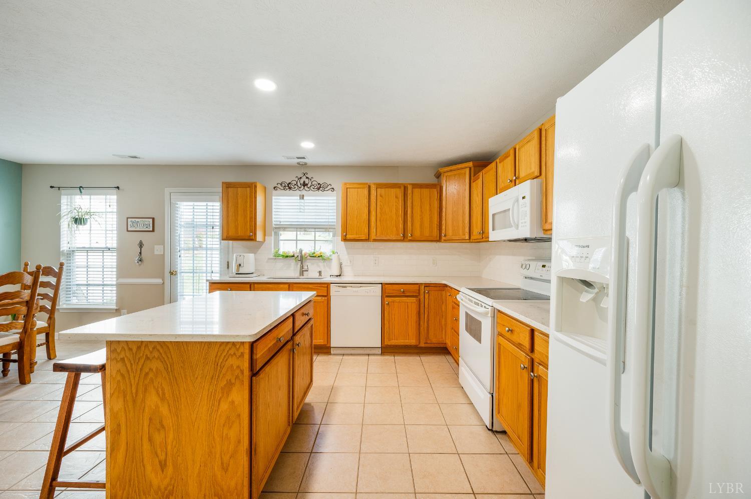 1011 Middle View Drive Forest, VA 24551 - Photo 11 of 44 a large kitchen with stainless steel appliances granite countertop a sink and cabinets