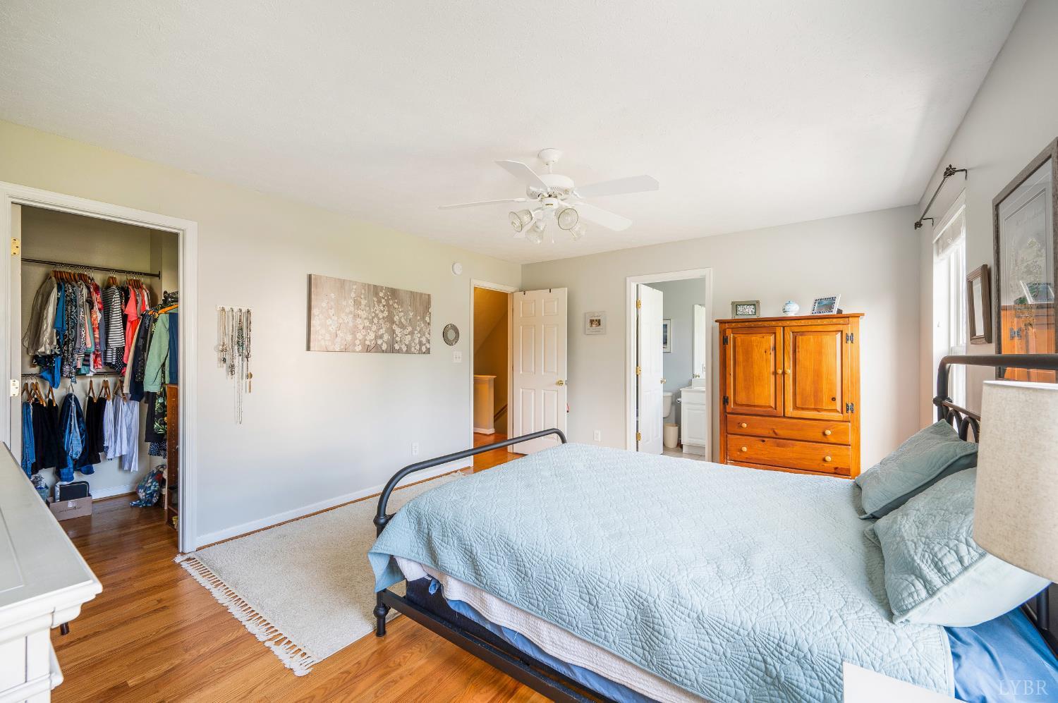 1011 Middle View Drive Forest, VA 24551 - Photo 20 of 44 a bedroom with a bed and a chandelier