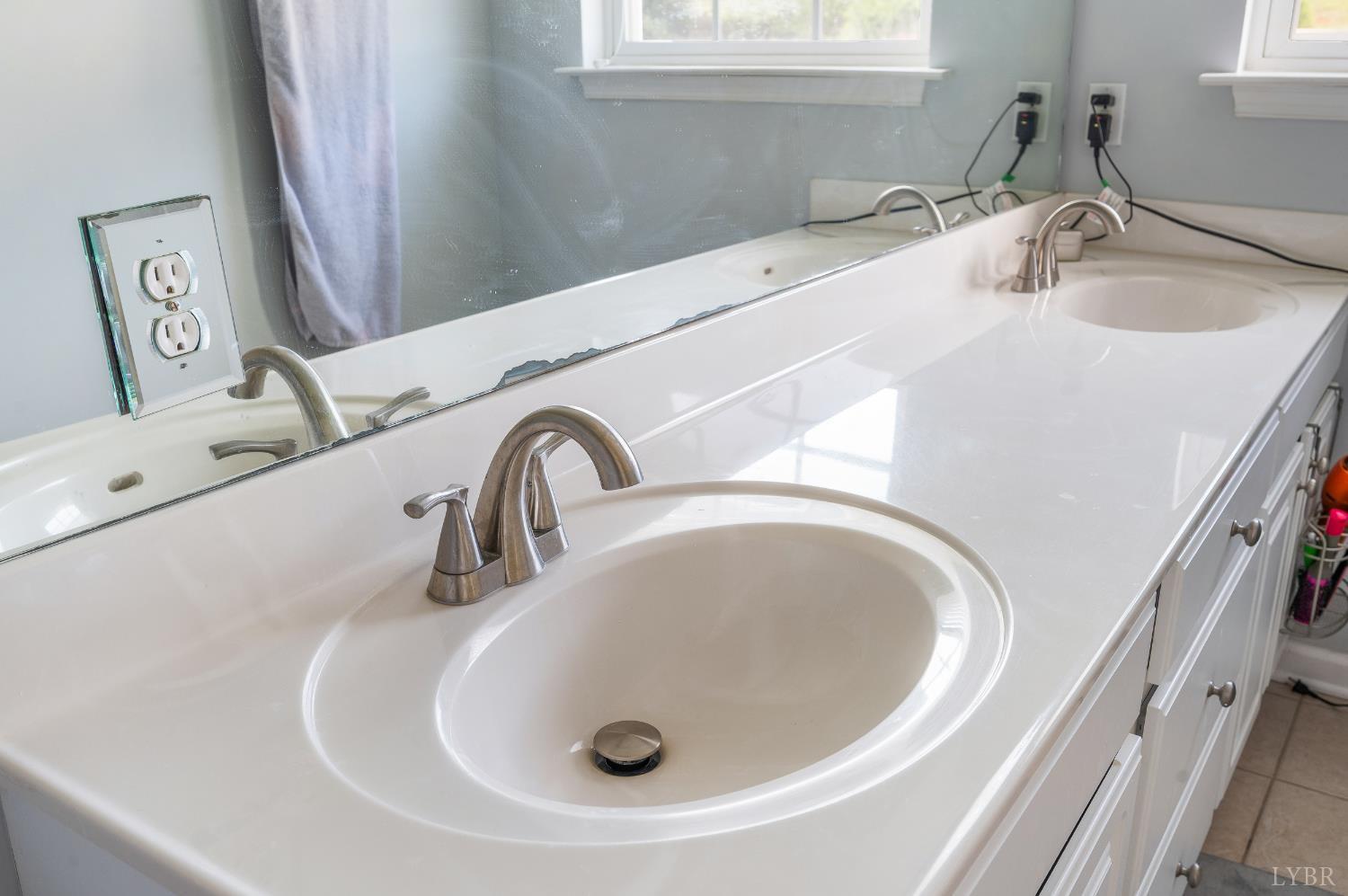 1011 Middle View Drive Forest, VA 24551 - Photo 23 of 44 a bathroom with a sink and a mirror