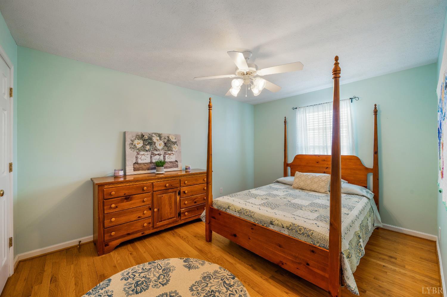 1011 Middle View Drive Forest, VA 24551 - Photo 29 of 44 a bedroom with a bed and wooden floor