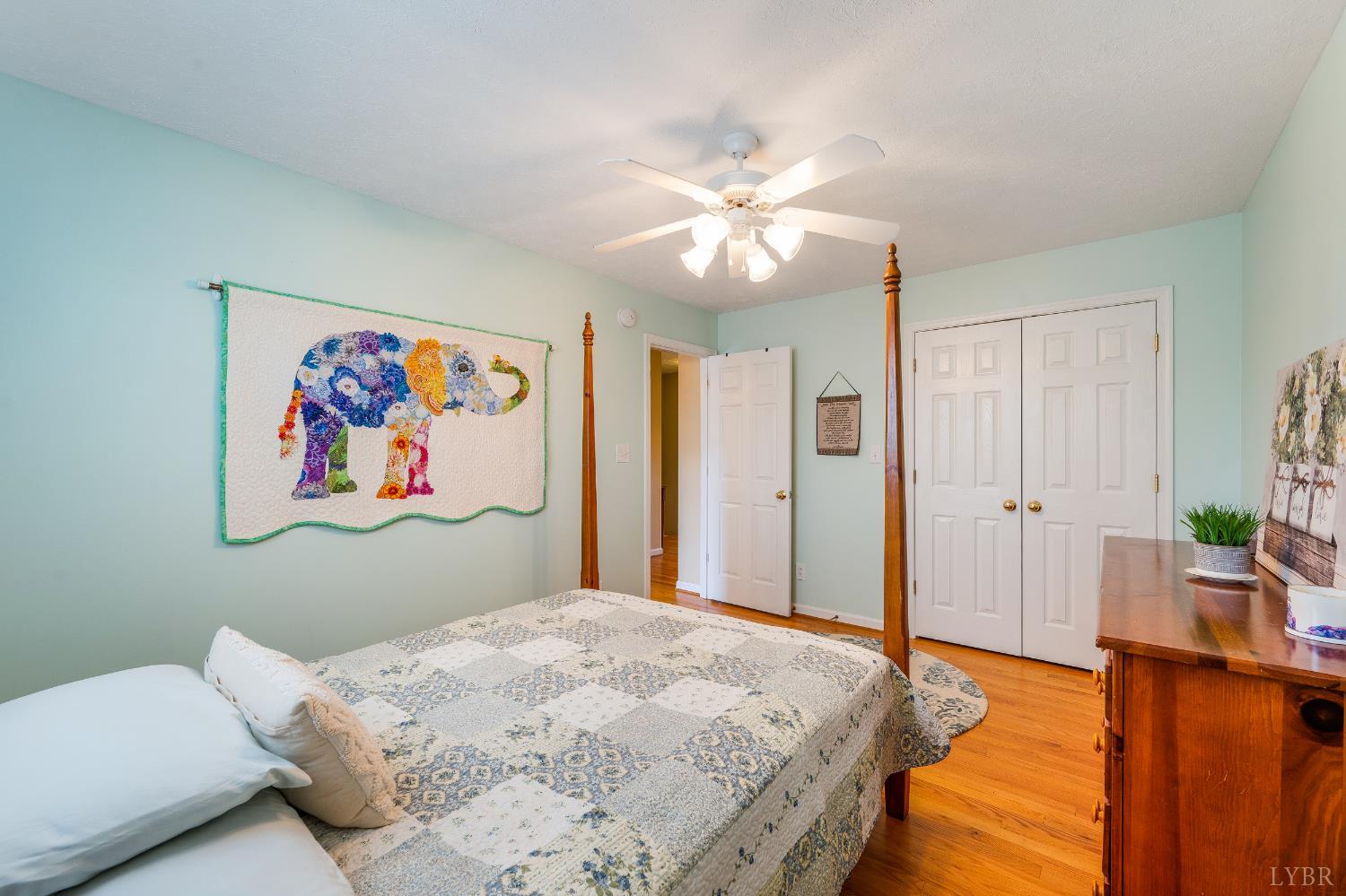 1011 Middle View Drive Forest, VA 24551 - Photo 30 of 44 a bedroom with a bed and a chandelier